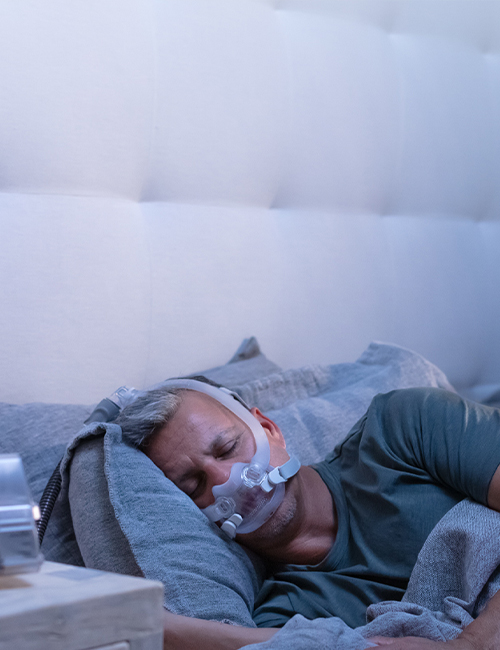 patient-sleeping-with-AirFit-F30i-tube-up-CPAP-mask-mobile